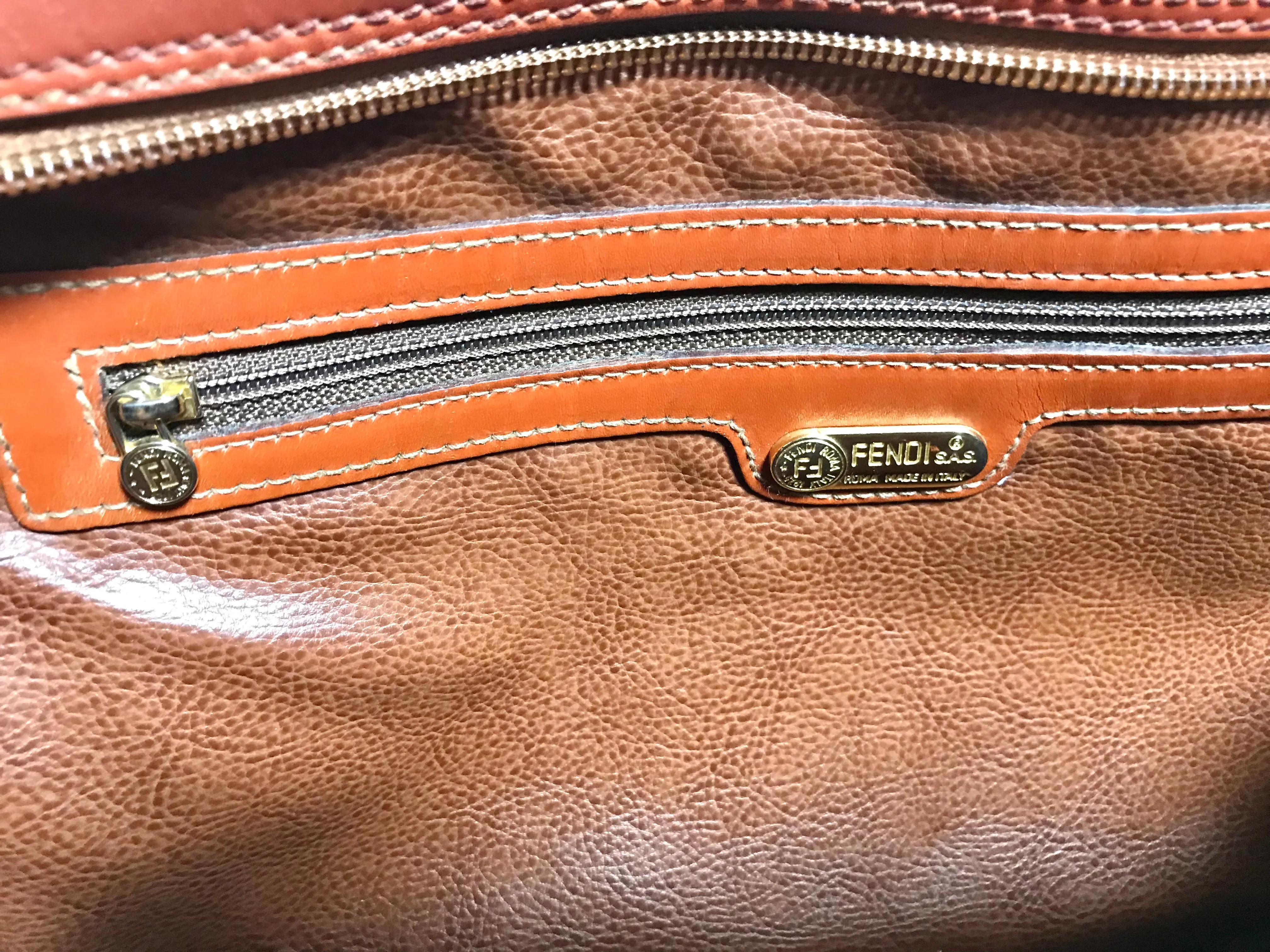 Vintage Fendi brown epi leather messenger bag, shoulder purse with iconic Janus medallion embossed motif at front. Unisex. Rare bag.