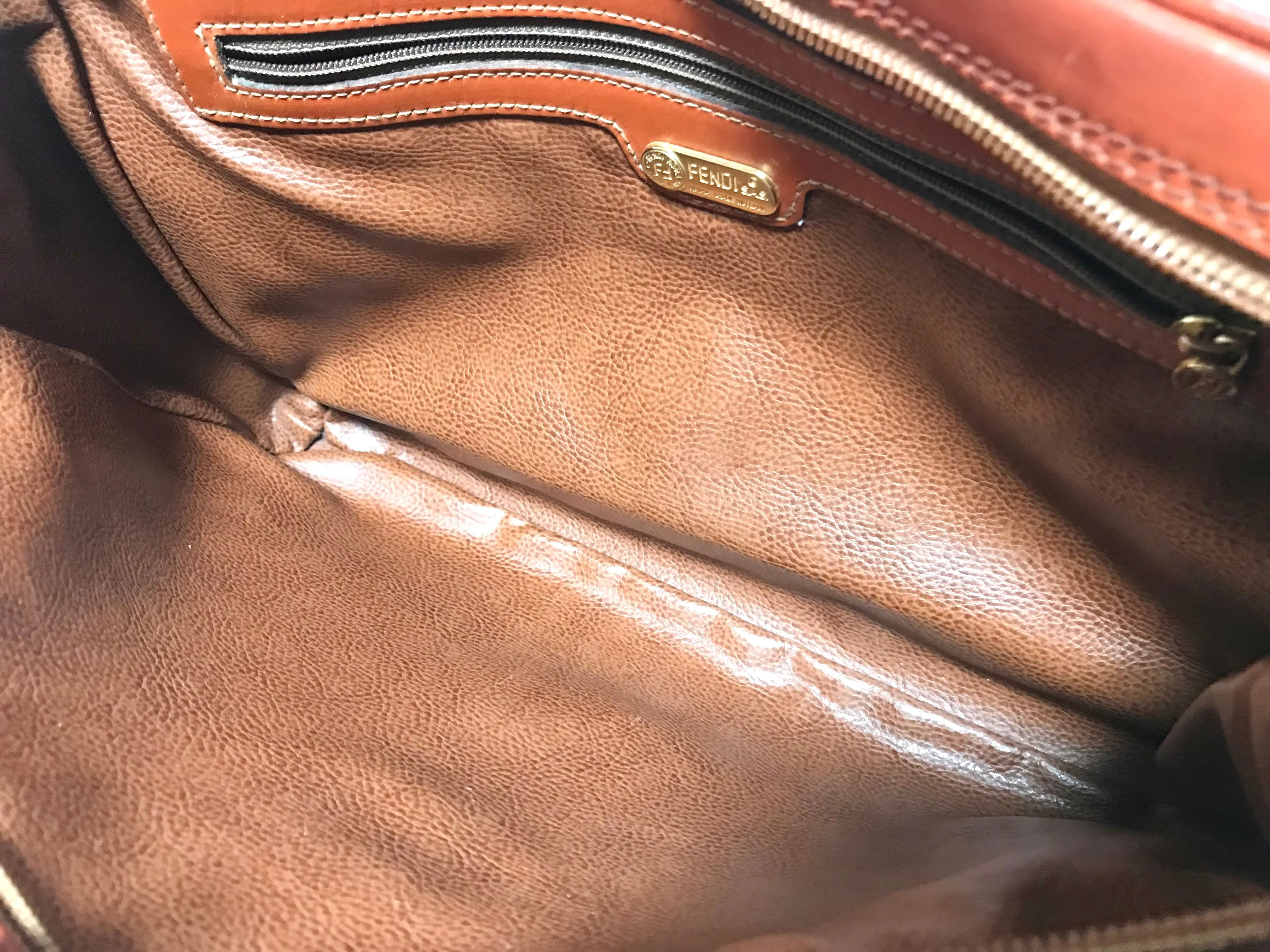 Vintage Fendi brown epi leather messenger bag, shoulder purse with iconic Janus medallion embossed motif at front. Unisex. Rare bag.