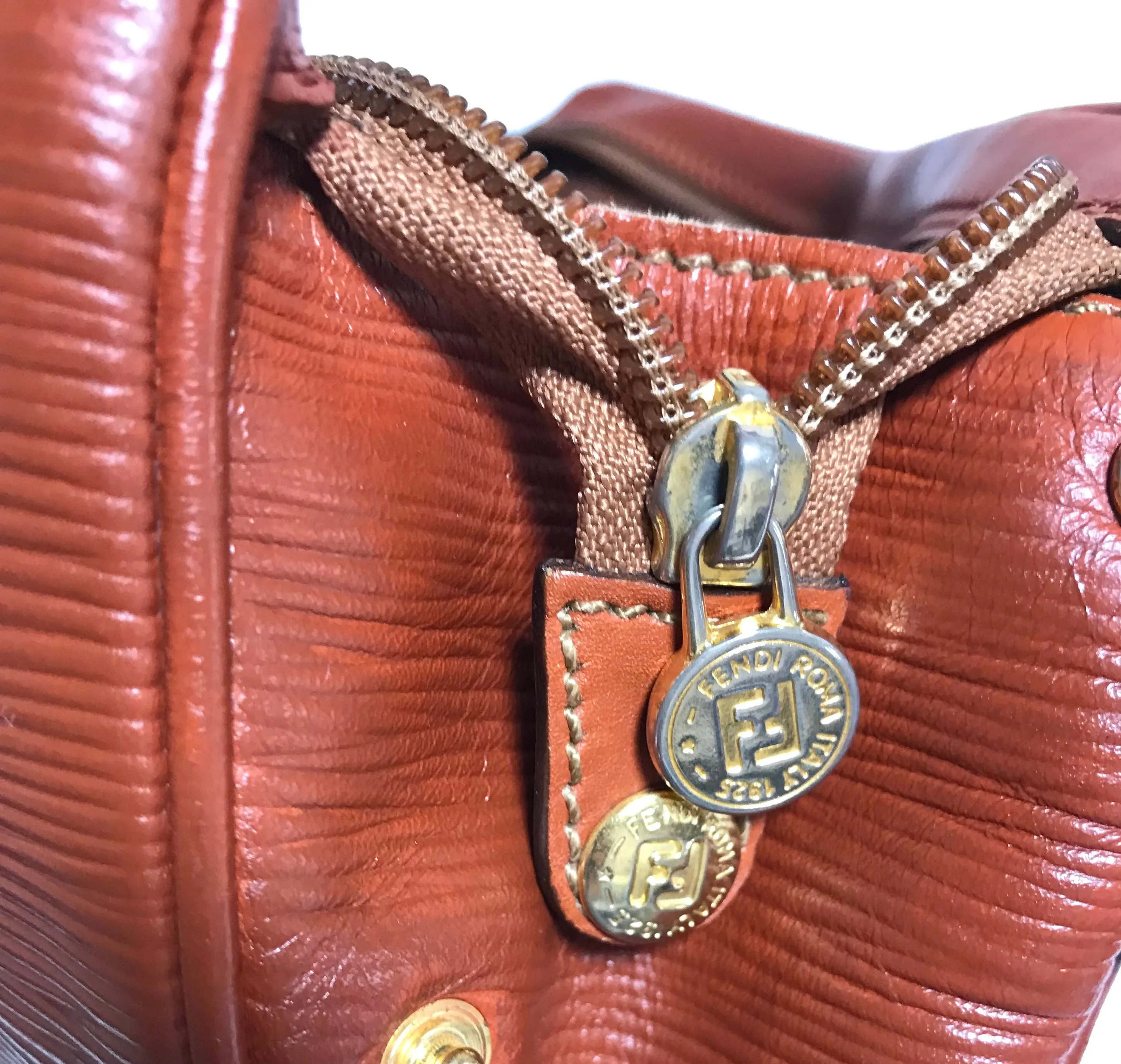 Vintage Fendi brown epi leather messenger bag, shoulder purse with iconic Janus medallion embossed motif at front. Unisex. Rare bag.